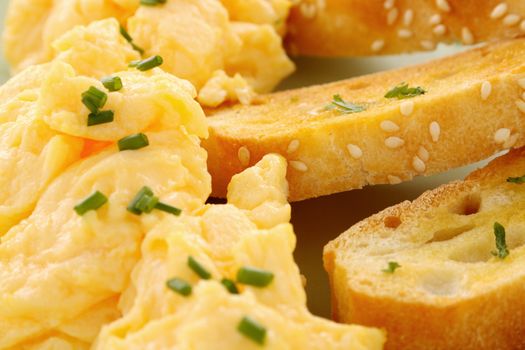 Delicious and healthy breakfast of scrambled eggs with Turkish bread toast.