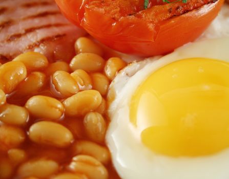 Fresh fried egg cooked to perfection with baked beans.