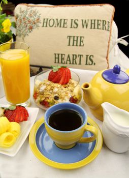Breakfast with tea, orange juice and muesli ready to serve.