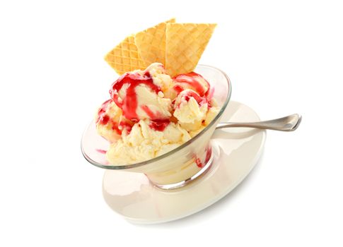 Vanilla ice cream with strawberry topping and golden wafers.