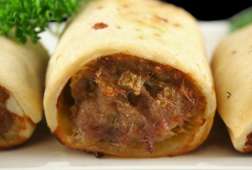 Delicious fresh baked homestyle sausage rolls ready to serve.