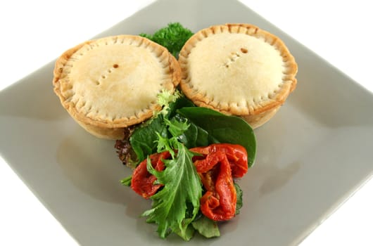 Fresh baked homemade beef pies with sundried tomato salad.