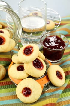 Delicious fresh baked jam drops with strawberry jam and sparkling water.