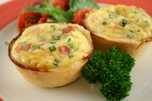 Freshly baked homemade mini quiches with a garden salad.