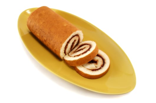 Sliced strawberry jam roll ready to serve.