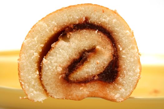 Sliced strawberry jam roll ready to serve.
