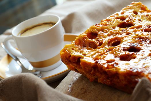Delightful fresh baked crisp and crunchy sweet honeycomb dessert with coffee.