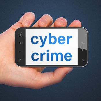 Safety concept: hand holding smartphone with word Cyber Crime on display. Mobile smart phone on Blue background, 3d render