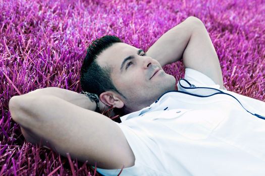 Man portrait lying on the grass.Dreamscape