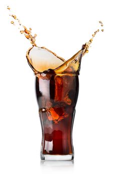 Splash of cola in a glass isolated on a white background