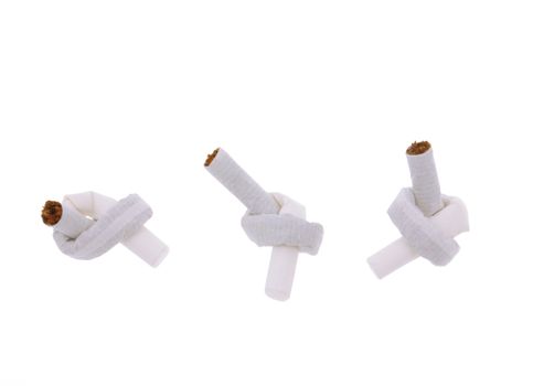 Three cigarettes lying side by side, each tied to a node