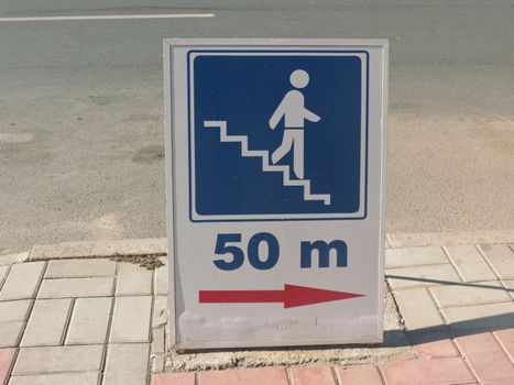     On the sidewalk, road sign is that the underground passage through the 50 m                           