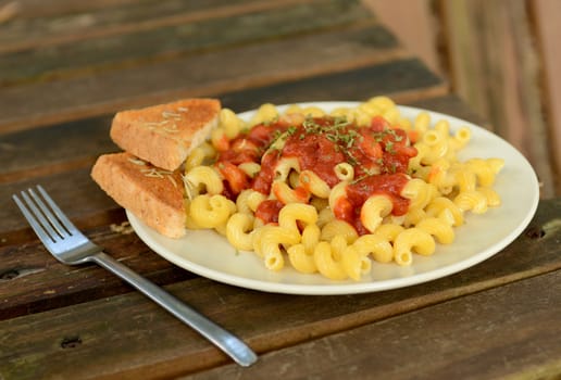 pasta with tomato sauce and garlic bread