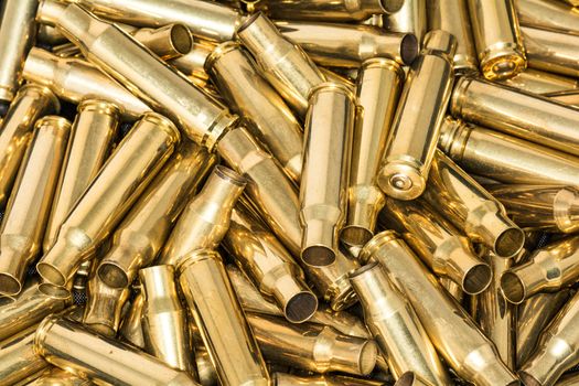 Abstract of pile of empty bullet shells with details