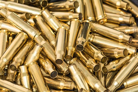 Abstract of pile of empty bullet shells with details