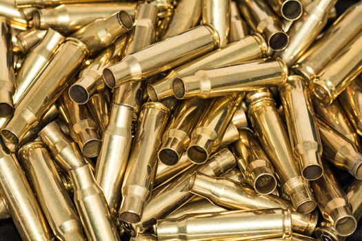 Abstract of pile of empty bullet shells with details