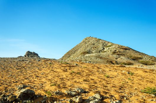 Pilon de Azucar hill rising above a dry barren desert in La Guajira, Colombia