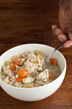 Hot bowl of fresh homemade traditional chicken soup.