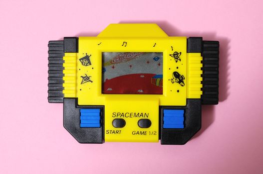 One Old Yellow Vintage Videogame with four Buttons