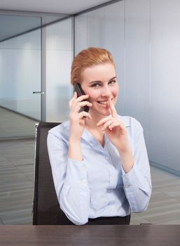 Businesswoman on phone gesturing quite during calling