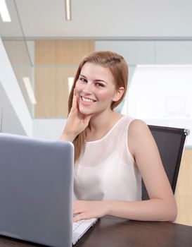 business woman looking at the camera in office