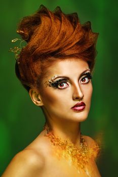 Close-up portrait of a young and attractive girl with hairstyle and jewelry