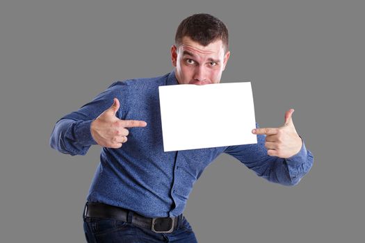 Man holding an empty table, isolated on background