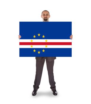 Smiling businessman holding a big card, flag of Cape Verde