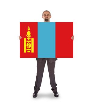 Smiling businessman holding a big card, flag of Mongolia