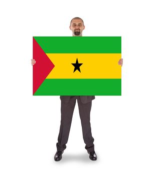 Smiling businessman holding a big card, flag of Sao Tome and Principe