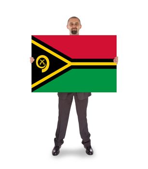 Smiling businessman holding a big card, flag of Vanuatu