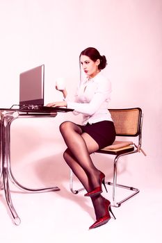 portrait of attractive secretary working on lap top computer