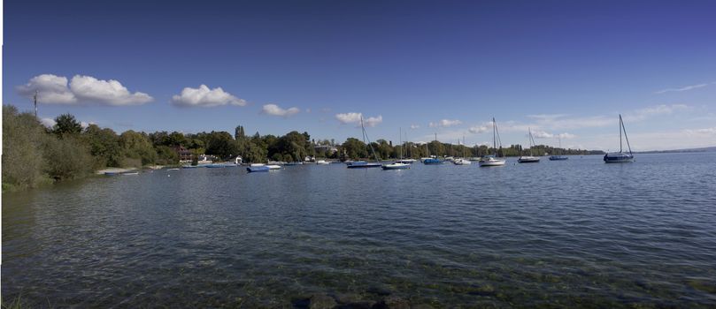 lake of constance with view to the landscape and sailing boats 