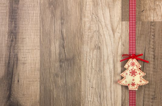 Christmas decoration with wood background, Christmas tree red with ribbon 