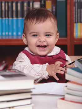 a beautiful caucasian baby in the library