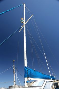 Mast of a modern yacht against blue sky