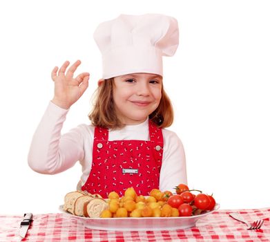 little girl cook with ok hand sign and gourmet food