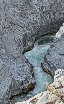 The Alcantara is a river in Sicily. It has its source on the south side of Monti Nebrodi and its mouth in the Ionian Sea at Capo Schiso in Giardini-Naxos. The river is 52 km long.