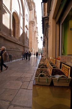 Market spices at the foot of the Tower of the Cathedral of Granada, Spain