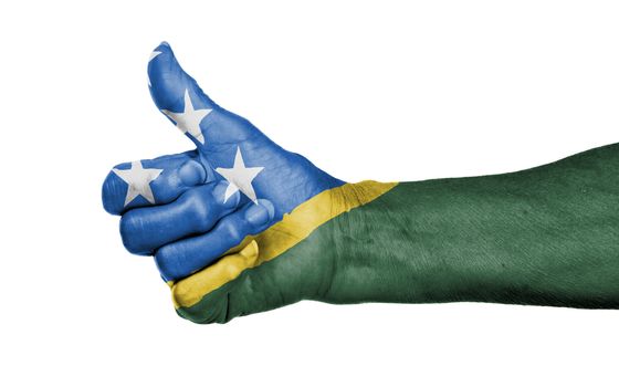 Old woman giving the thumbs up sign, isolated, flag of The Solomon Islands