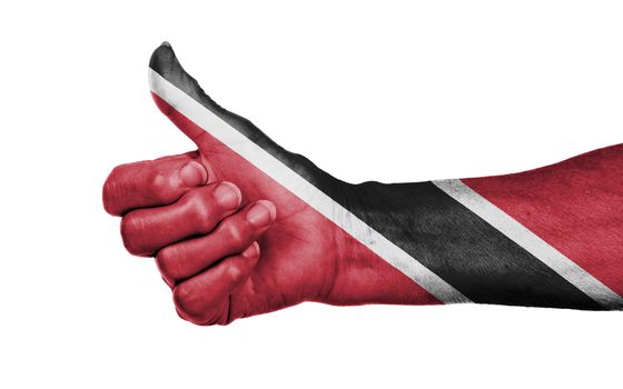 Old woman giving the thumbs up sign, isolated, flag of Trinidad and Tobago