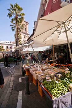 Grocery stores close to the tower of the cathedral. Romanilla square. Granada, Spain