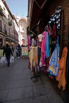 Trades in Marques street with cathedral in the background, Granada, Spain