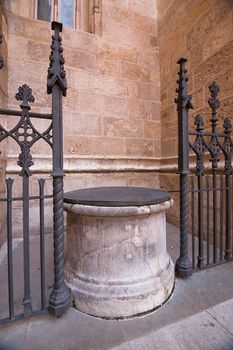 Well next to the gateway to the Royal Chapel, Cathedral, Granada, Spain