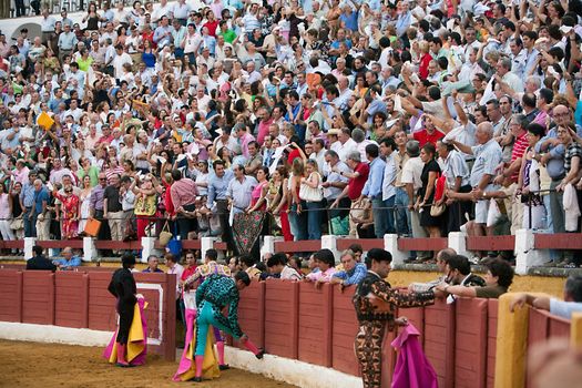 People wave white handkerchiefs for the trophies for the great bullfight, Spain