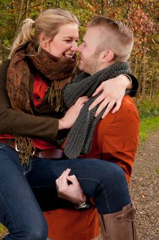 Happy young couple is having a nice time in october