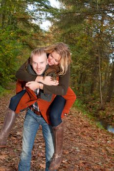 Happy young couple is having a nice time in october