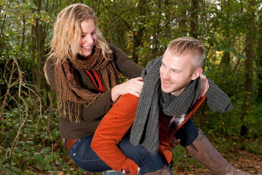 Happy young couple is having a nice time in october