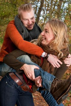 Happy young couple is having a nice time in october