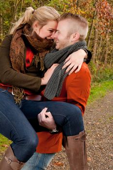 Happy young couple is having a nice time in october